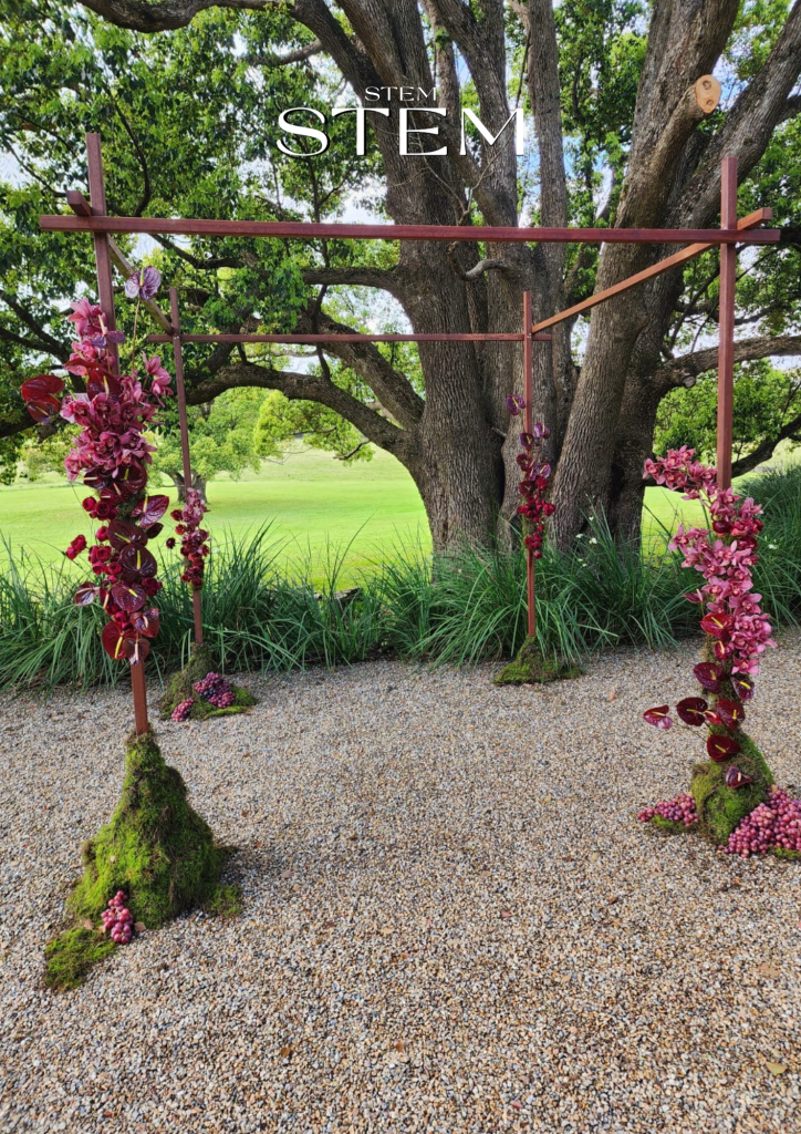 Stem Design created this outdoor wedding installation with orchids and anthuriums, showcasing the beauty of outdoor ceremonies in Brisbane and the Gold Coast.