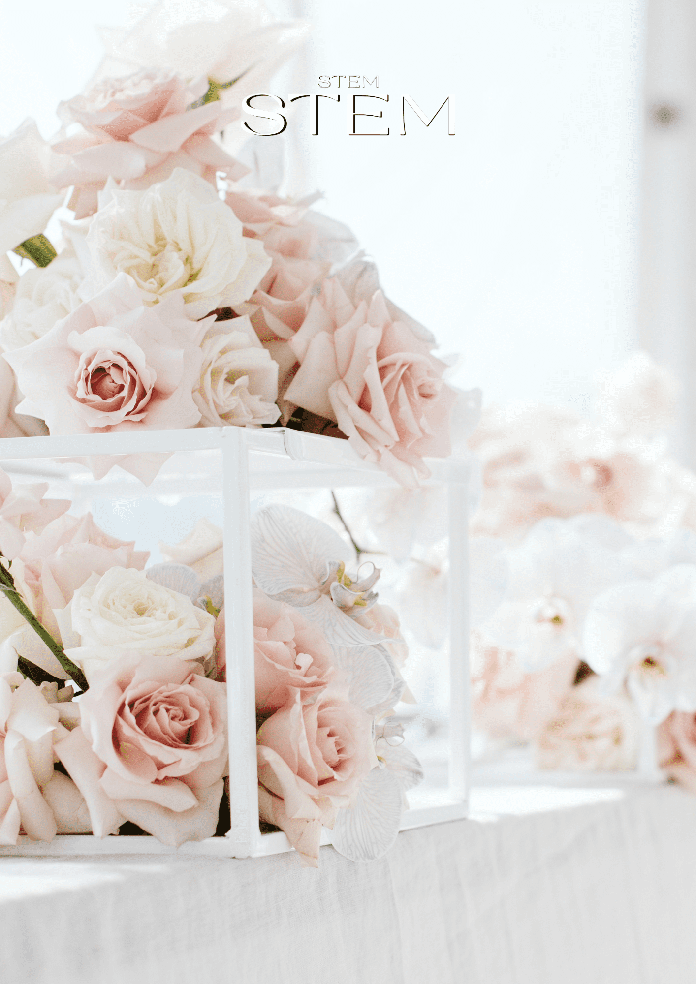 Wedding florist Brisbane styling soft blush and white wedding flowers for an elegant reception table